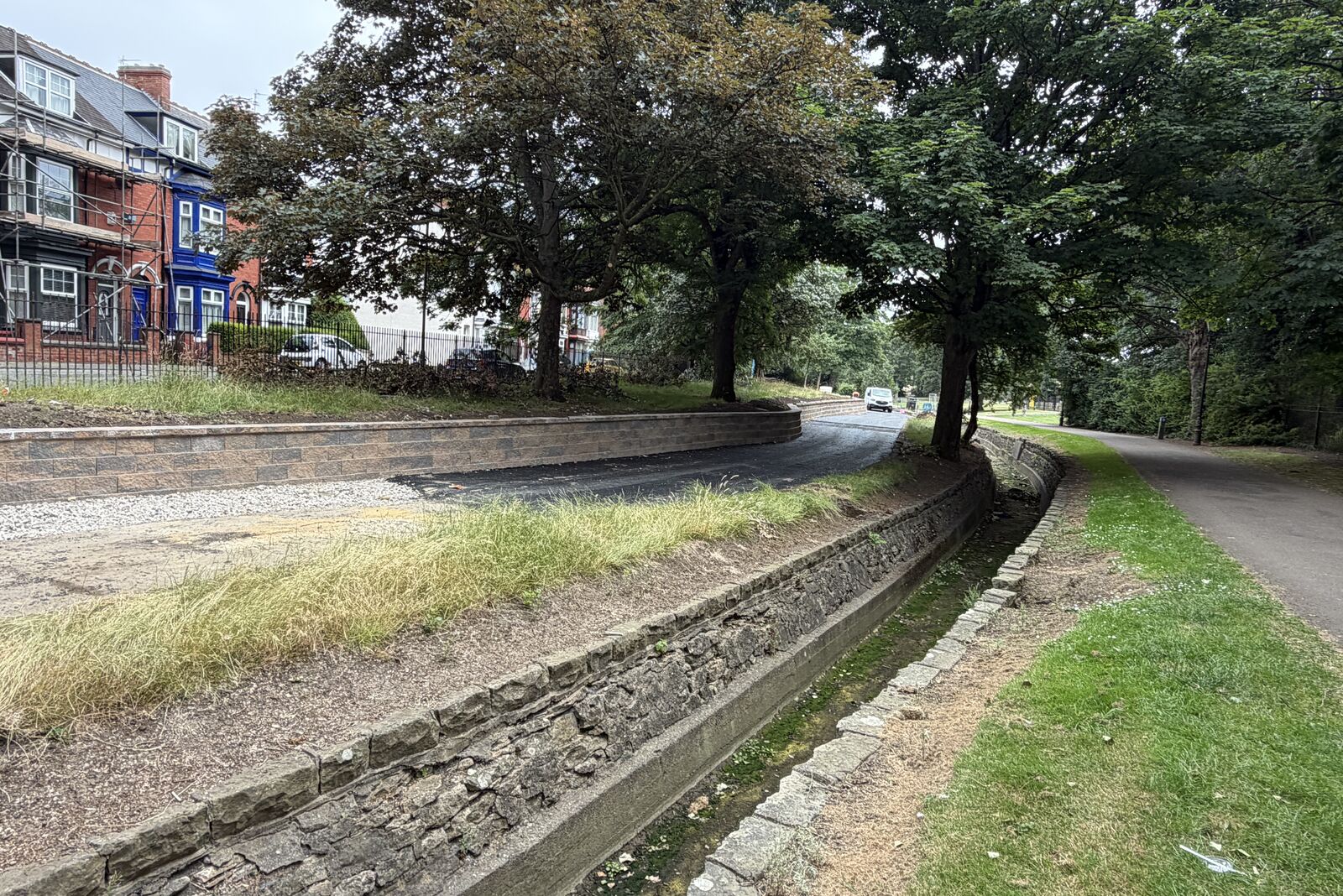 Overview of the terraced site at Burn Valley Gardens with the channelised burn at the foot of the slope