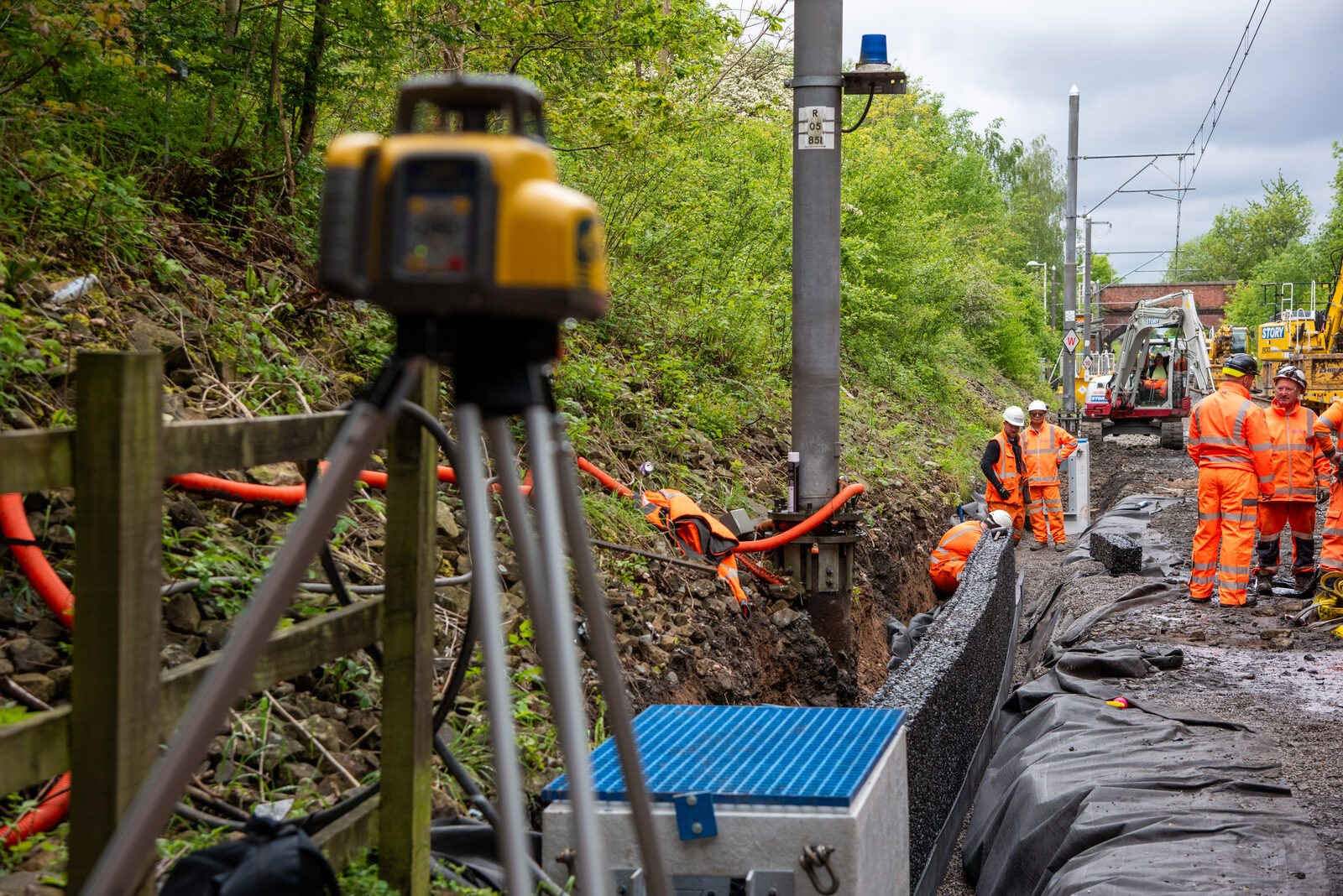 Laser level checking gradients along the drainage run