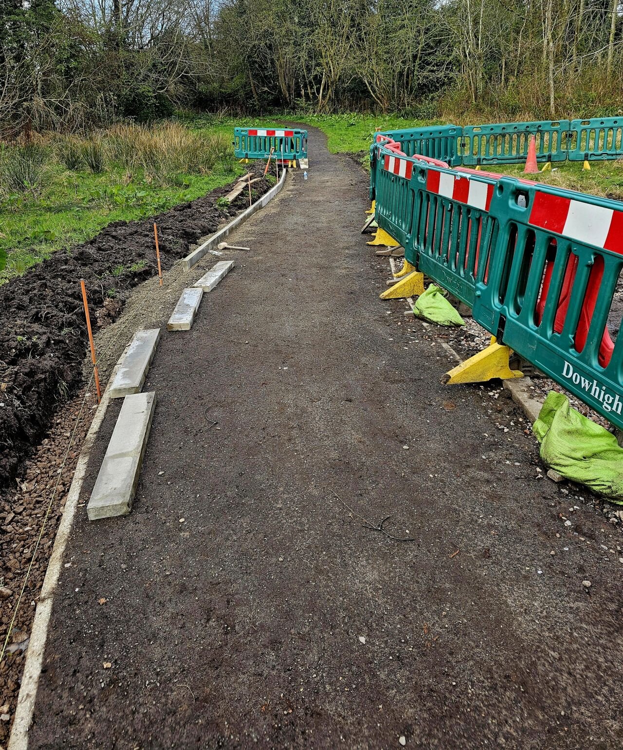 DOWHIGH preparing the path: concrete kerb edging set and sub-base excavated