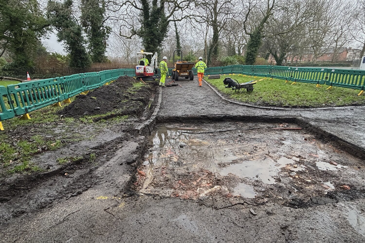 Site preparation showing waterlogged conditions before drainage installation