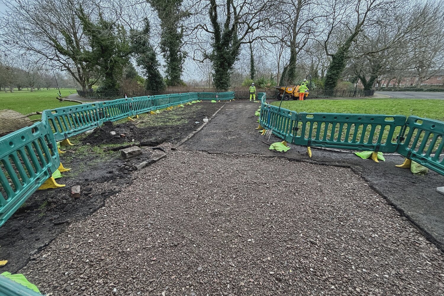 Completed drainage mat installation covered with gravel surfacing