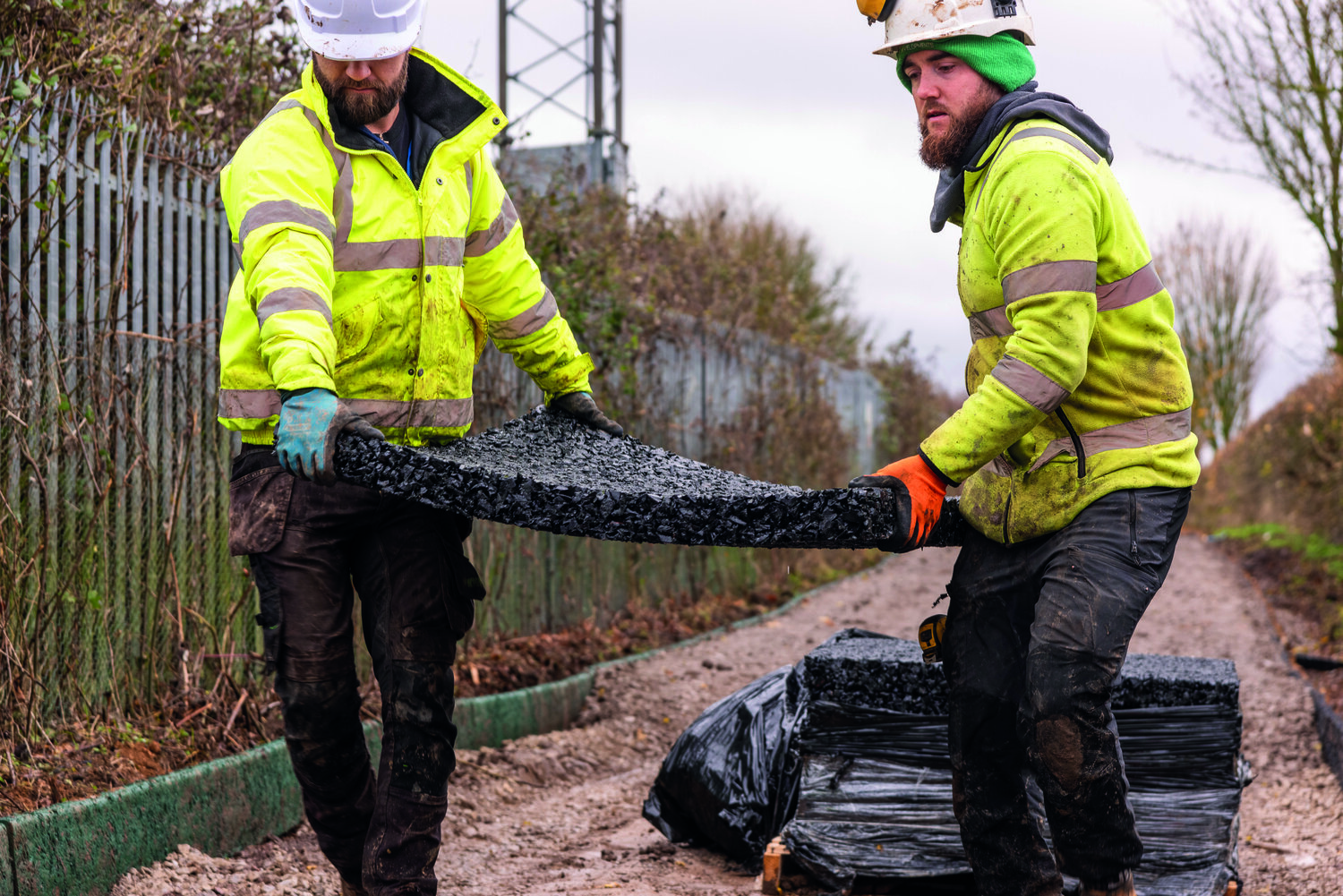 Workers placing Rosehill Drainage Mat