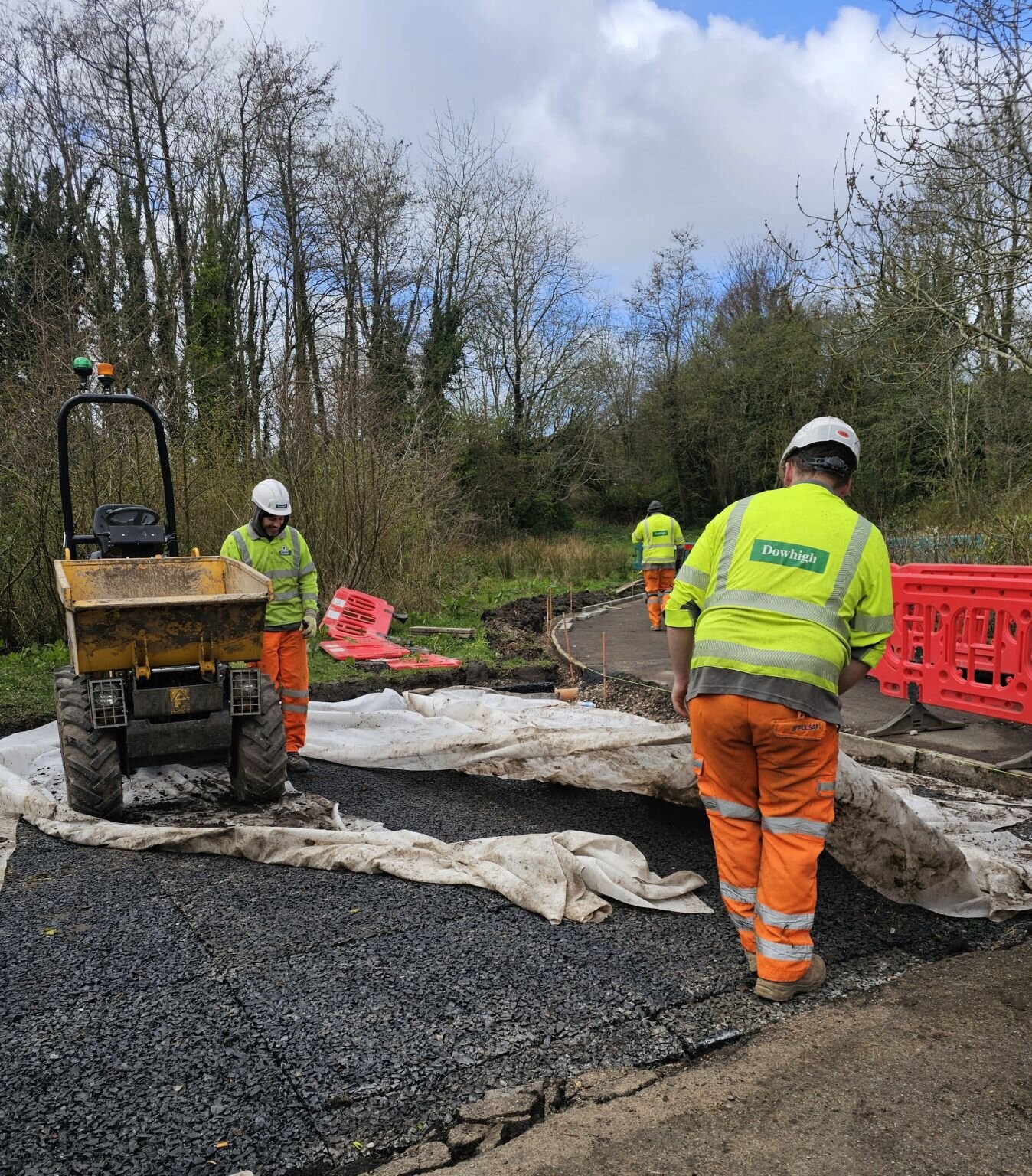 Drainage mats being laid over a geotextile filter layer during installation